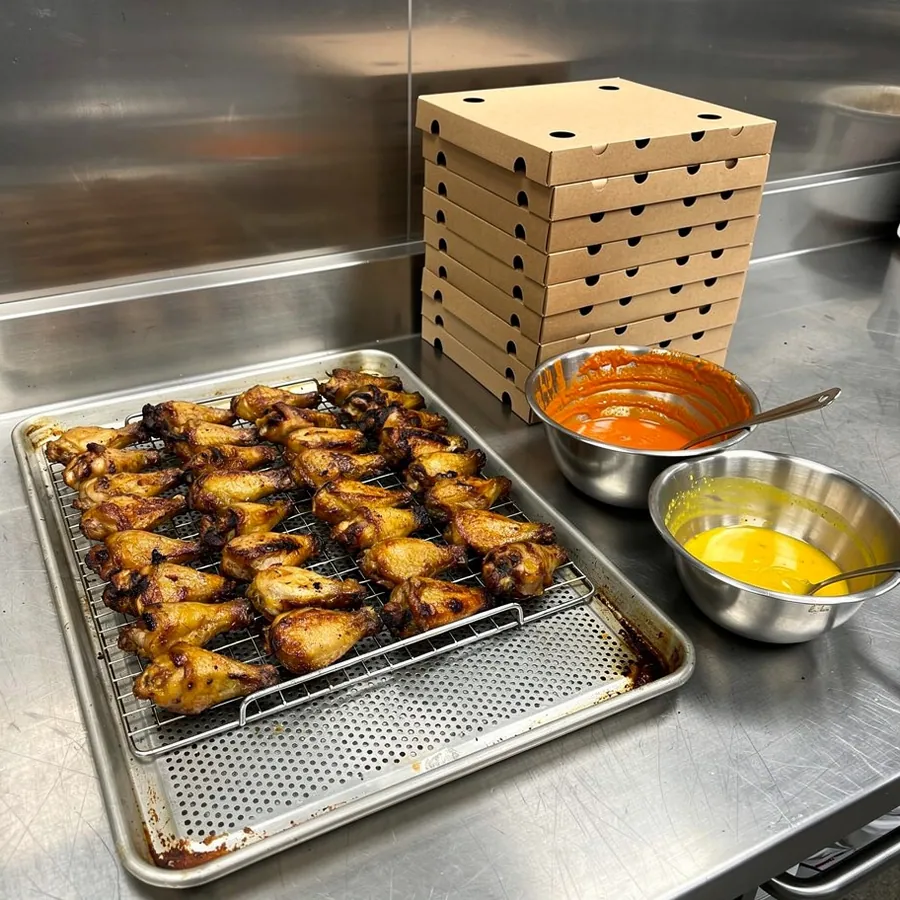 Crispy wings resting on wire rack