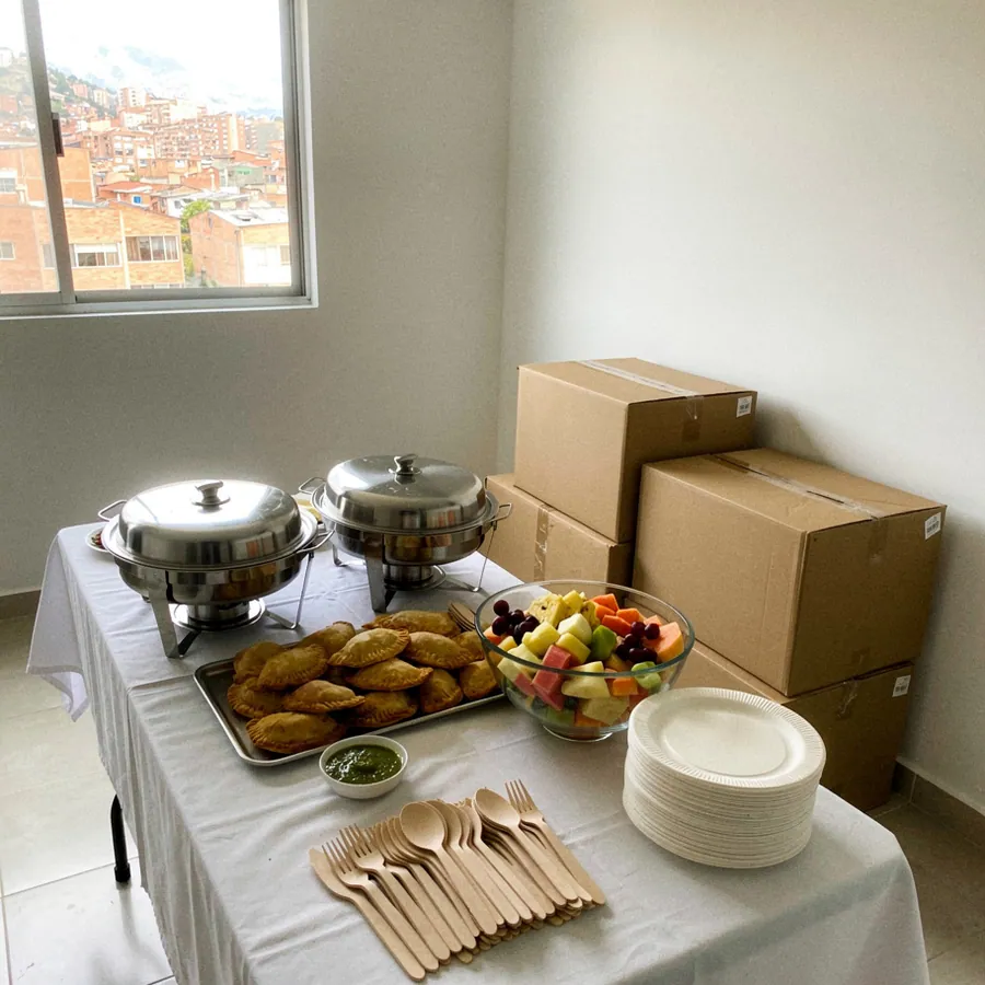 Housewarming buffet among unopened moving boxes Housewarming buffet among unopened moving boxes